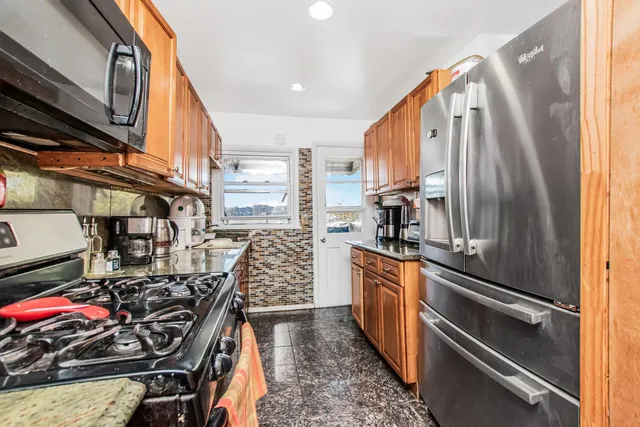 a kitchen that has a lot of cabinets in it