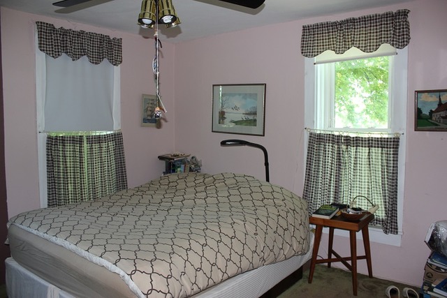 17530 Millard Road Morrison, IL 61270 - Photo 12 of 17 a bed sitting in a bedroom next to a window