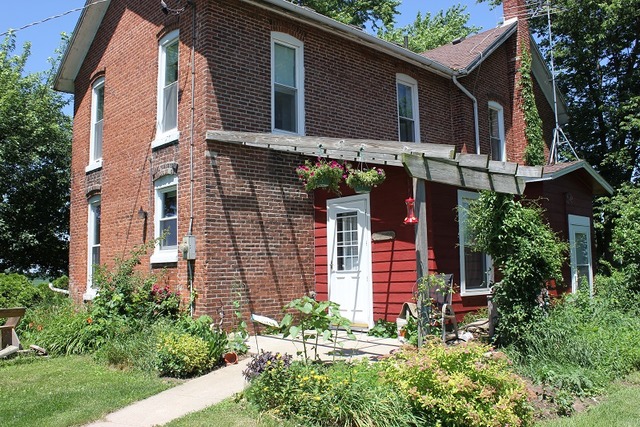 17530 Millard Road Morrison, IL 61270 - Photo 2 of 17 a front view of a house with a yard