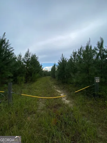 a view of an outdoor space and tennis court