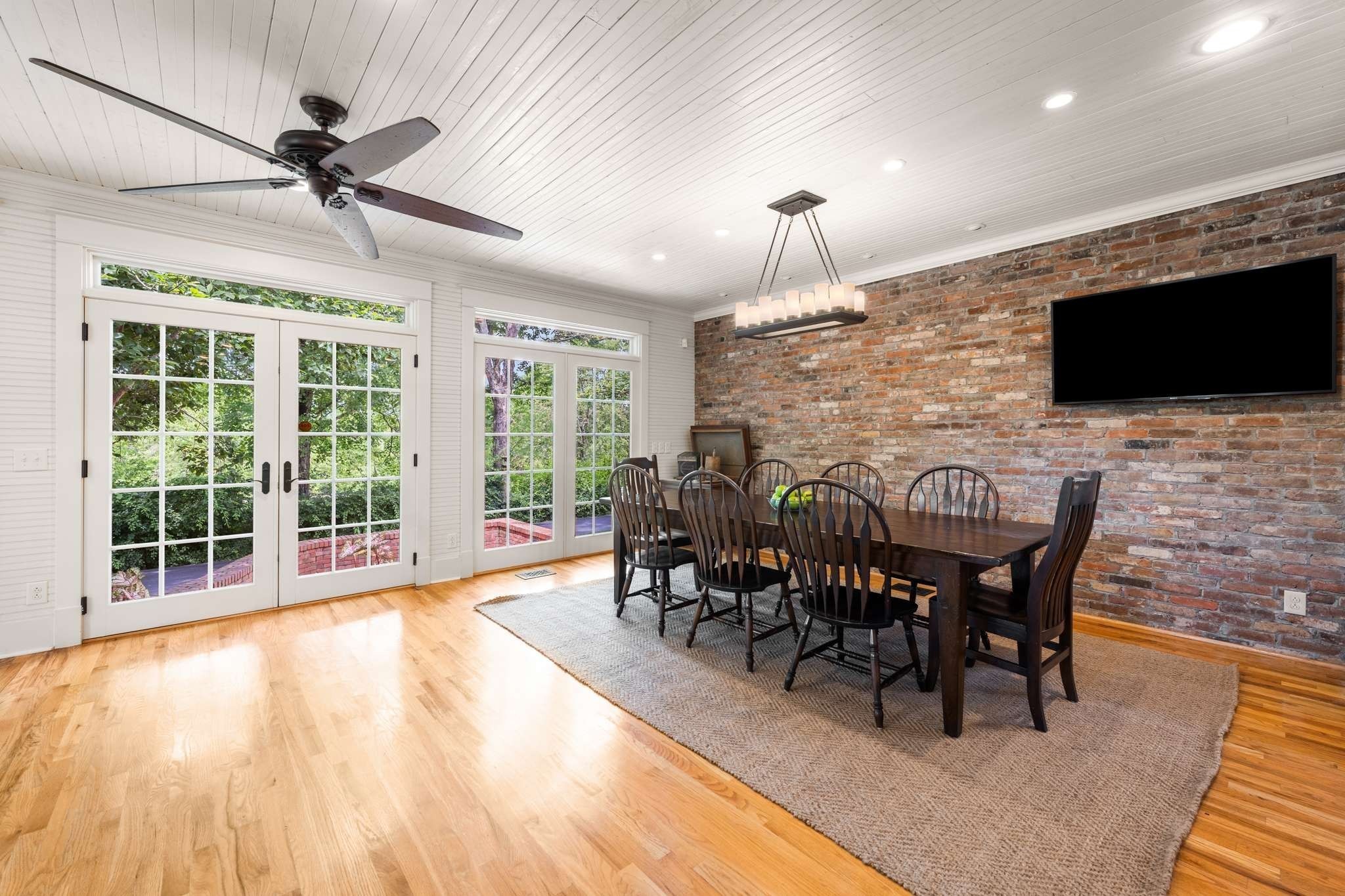 405 Webb Road West Bell Buckle, TN 37020 - Photo 19 of 70 a view of a dining room with furniture window and wooden floor