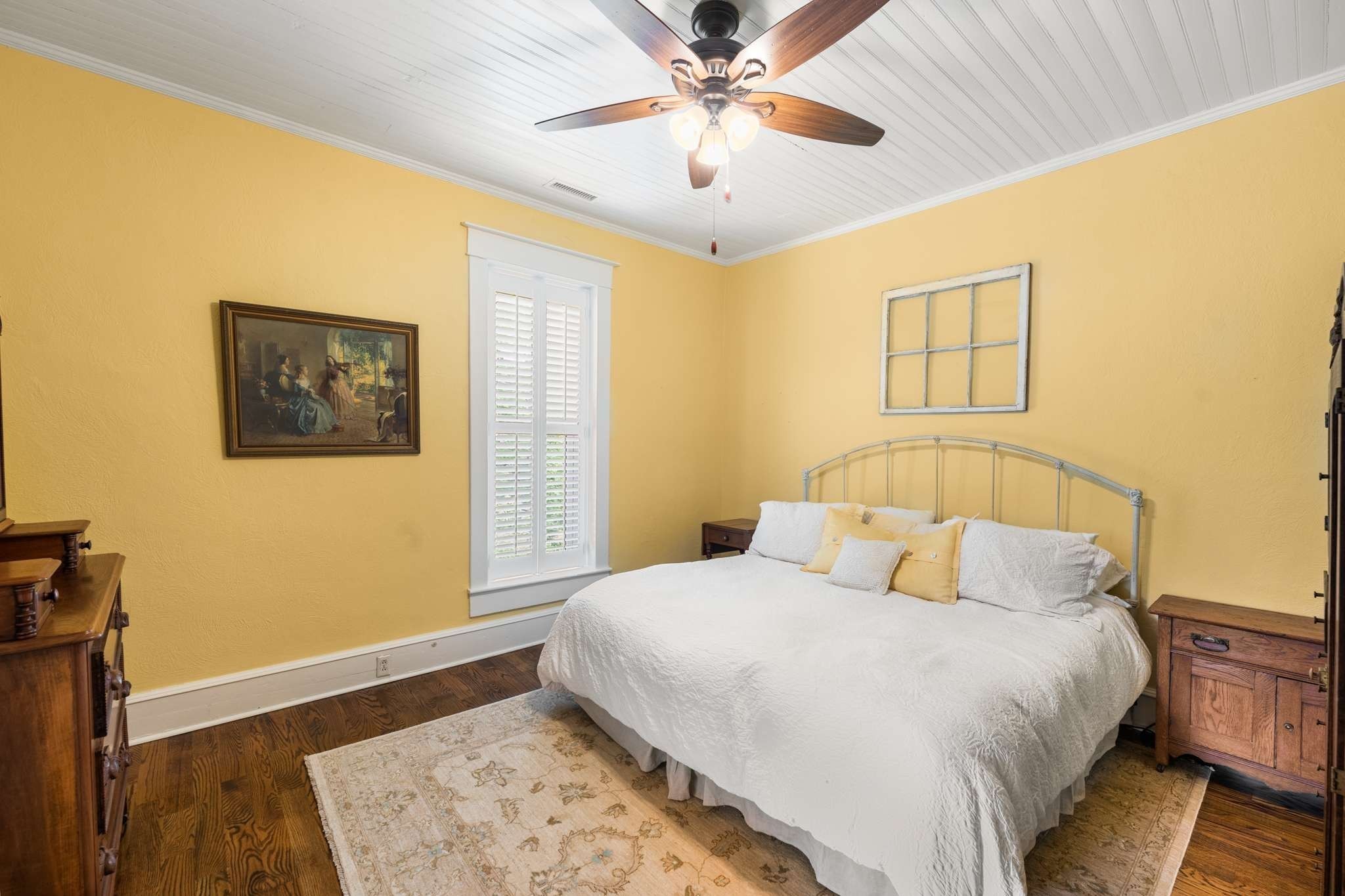 405 Webb Road West Bell Buckle, TN 37020 - Photo 24 of 70 a bedroom with a large bed and a chandelier