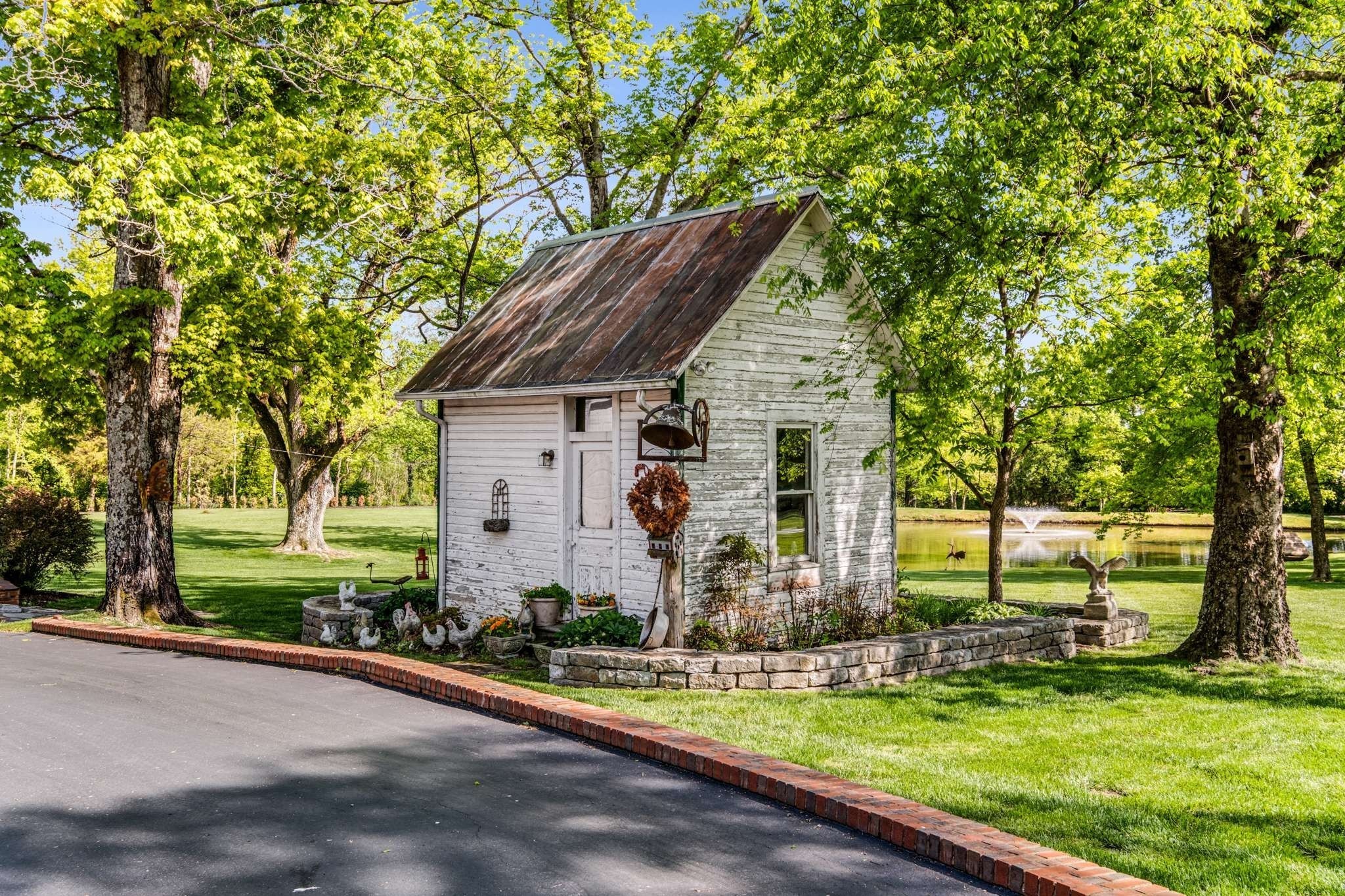 405 Webb Road West Bell Buckle, TN 37020 - Photo 57 of 70 a front view of house with yard and green space