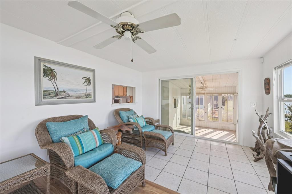 156 Martinique Road North Port, FL 34287 - Photo 11 of 46 a living room with furniture and a chandelier