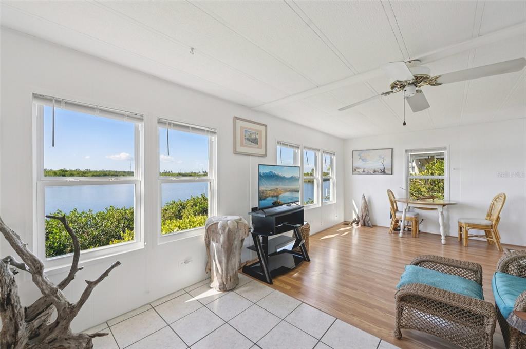 156 Martinique Road North Port, FL 34287 - Photo 12 of 46 a living room with furniture and a floor to ceiling window