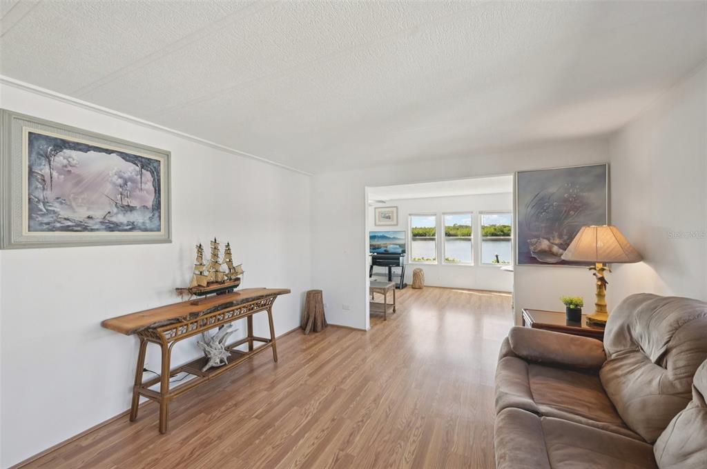 156 Martinique Road North Port, FL 34287 - Photo 15 of 46 a living room with furniture and a wooden floor