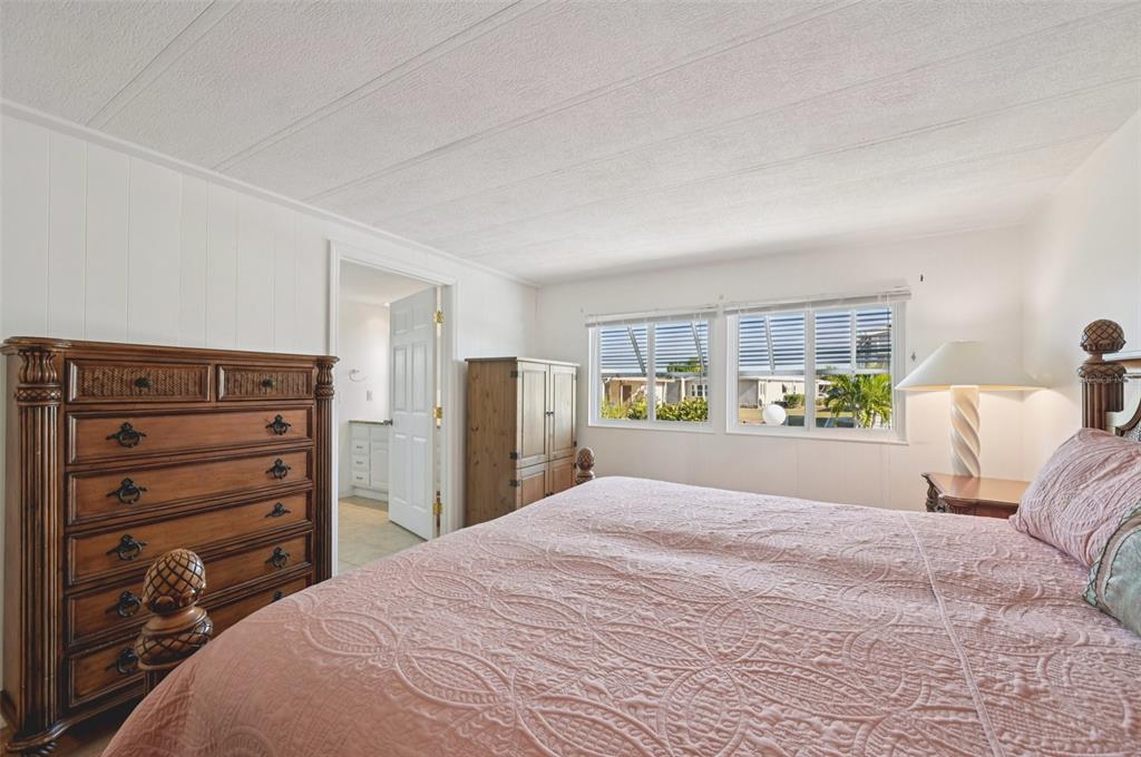 156 Martinique Road North Port, FL 34287 - Photo 16 of 46 a bedroom with a bed and a window