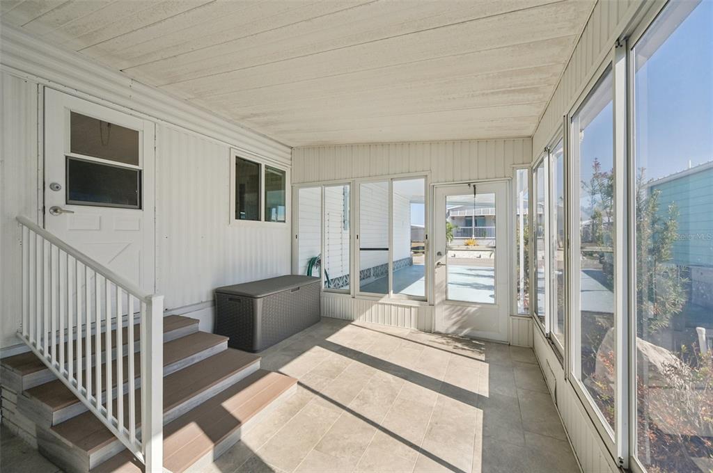 156 Martinique Road North Port, FL 34287 - Photo 30 of 46 a living room with furniture and a flat screen tv