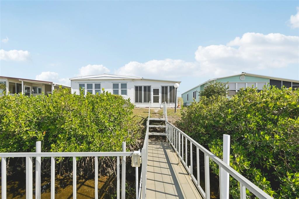 156 Martinique Road North Port, FL 34287 - Photo 32 of 46 a view of a house with wooden fence