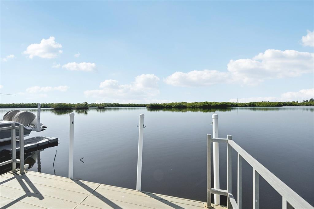156 Martinique Road North Port, FL 34287 - Photo 33 of 46 a view of a lake from a balcony