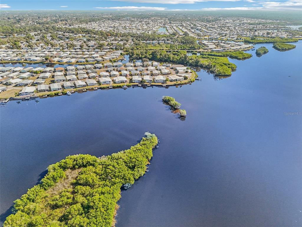 156 Martinique Road North Port, FL 34287 - Photo 40 of 46 an aerial view of a house with a lake view