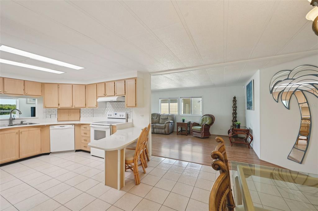156 Martinique Road North Port, FL 34287 - Photo 4 of 46 a large white kitchen with cabinets