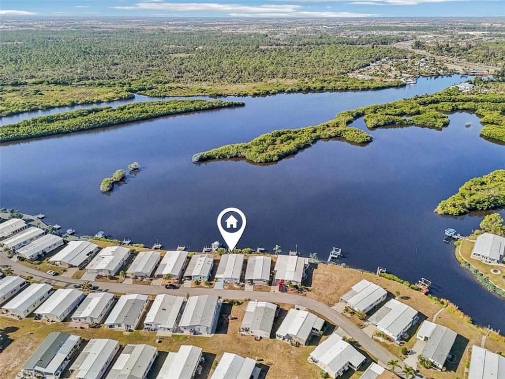 156 Martinique Road North Port, FL 34287 - Photo 42 of 46 an aerial view of a house with a lake view