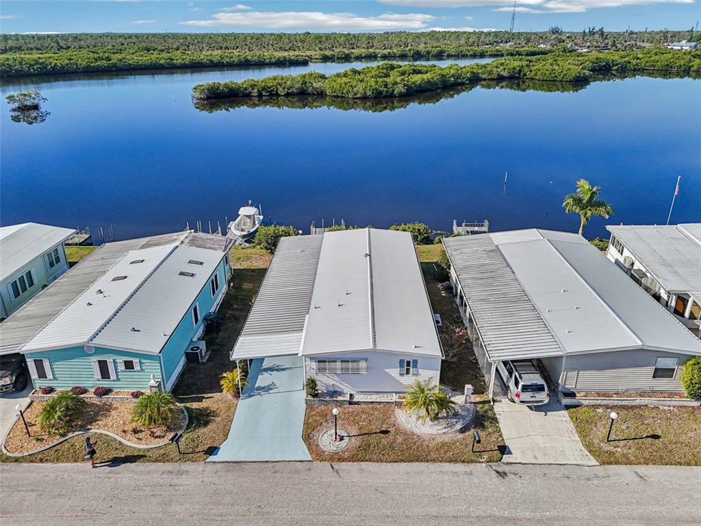 156 Martinique Road North Port, FL 34287 - Photo 46 of 46 an aerial view of a house with a lake view