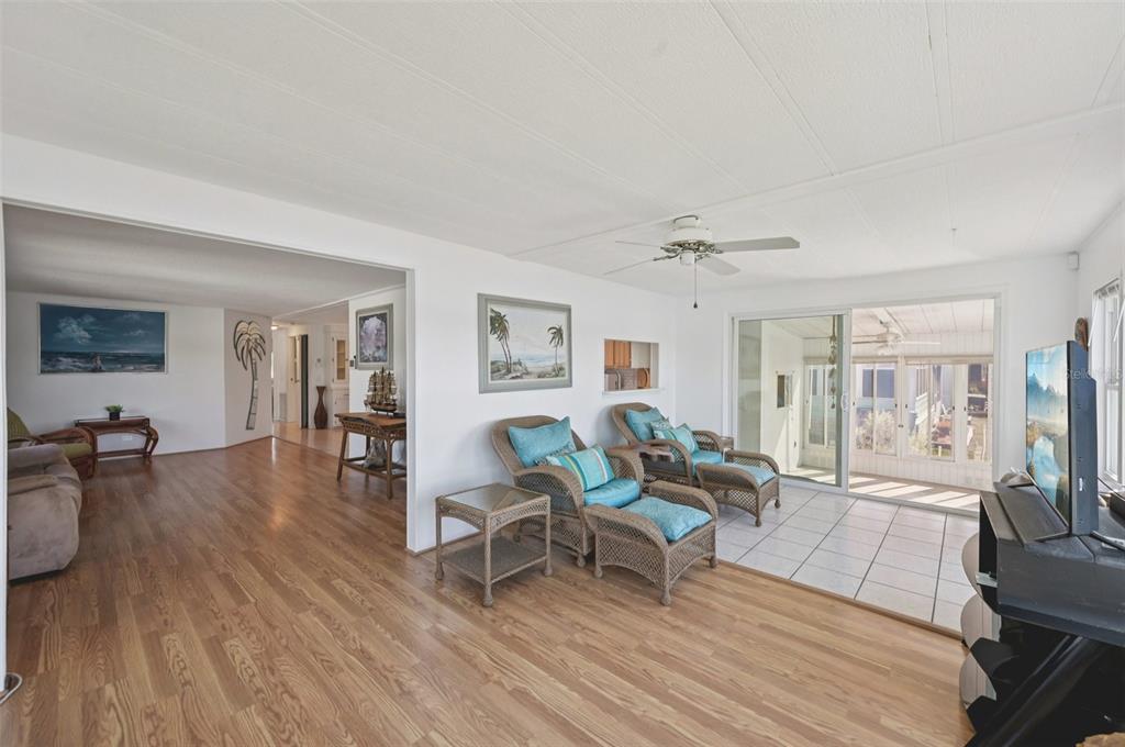 156 Martinique Road North Port, FL 34287 - Photo 9 of 46 a living room with furniture and a wooden floor