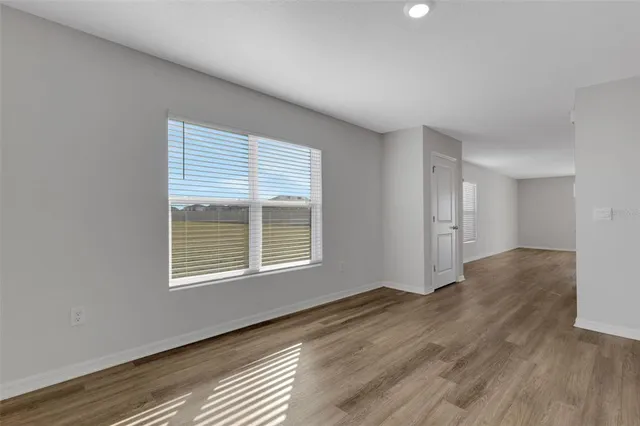 a kitchen with granite countertop a stove and a sink