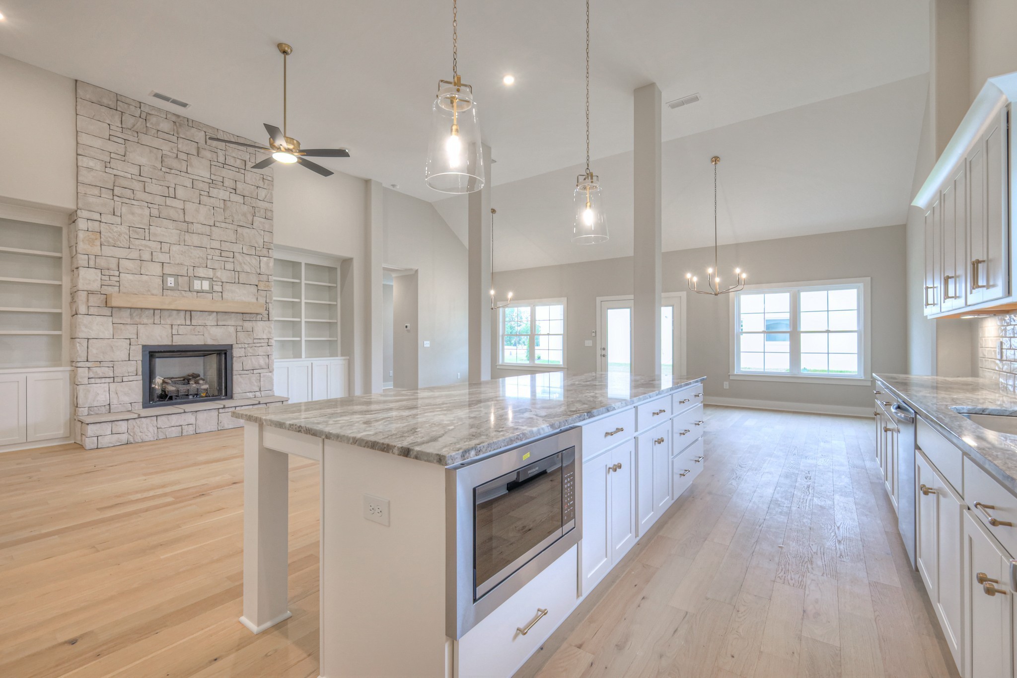 5536 Sinclair Street Murfreesboro, TN 37127 - Photo 12 of 46 a large kitchen with a stove and a wooden floor