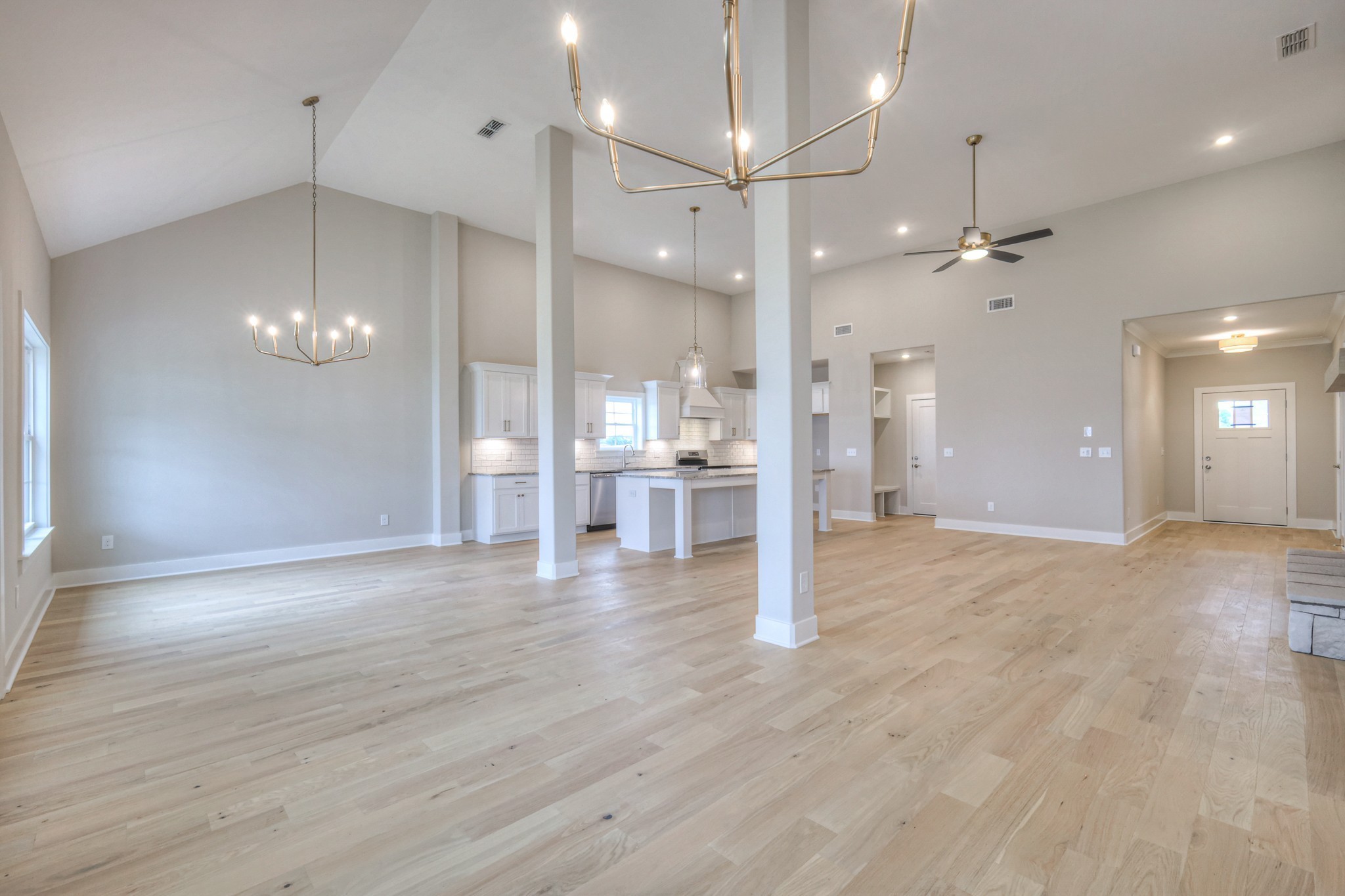 5536 Sinclair Street Murfreesboro, TN 37127 - Photo 15 of 46 an empty room with wooden floor and kitchen view