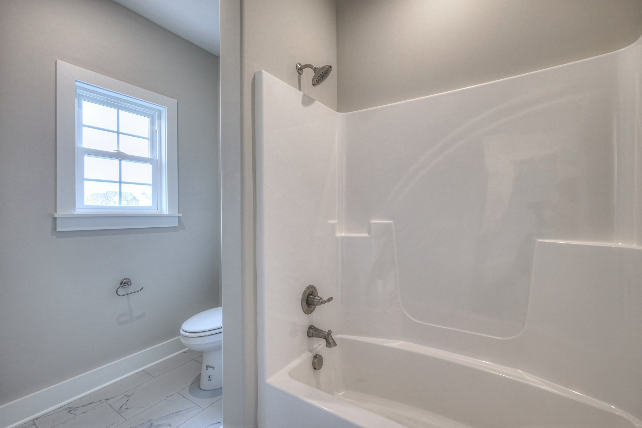 5536 Sinclair Street Murfreesboro, TN 37127 - Photo 25 of 46 a bathroom with a bathtub a toilet and a shower