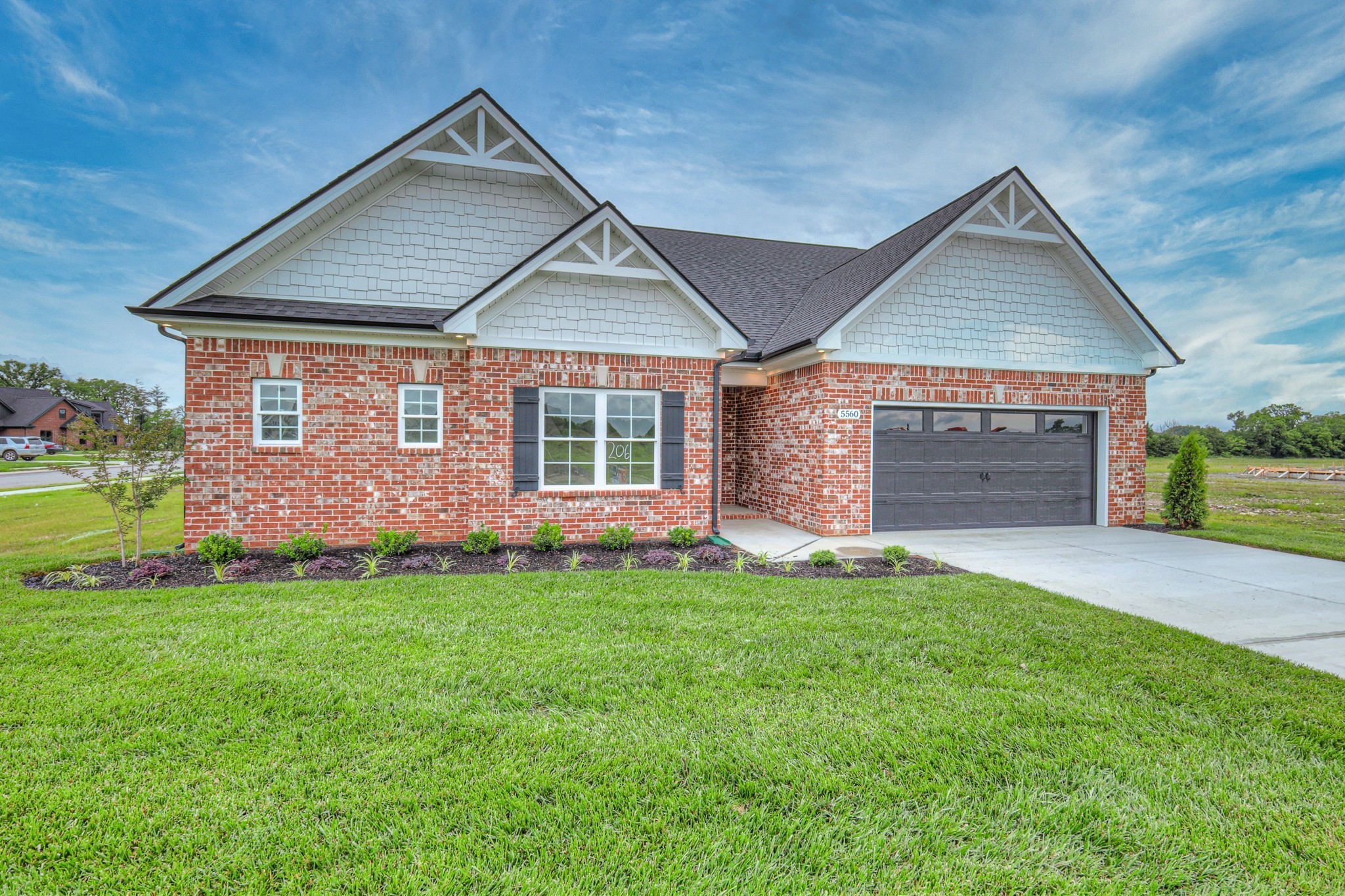 5536 Sinclair Street Murfreesboro, TN 37127 - Photo 3 of 46 a front view of a house with a yard and garage