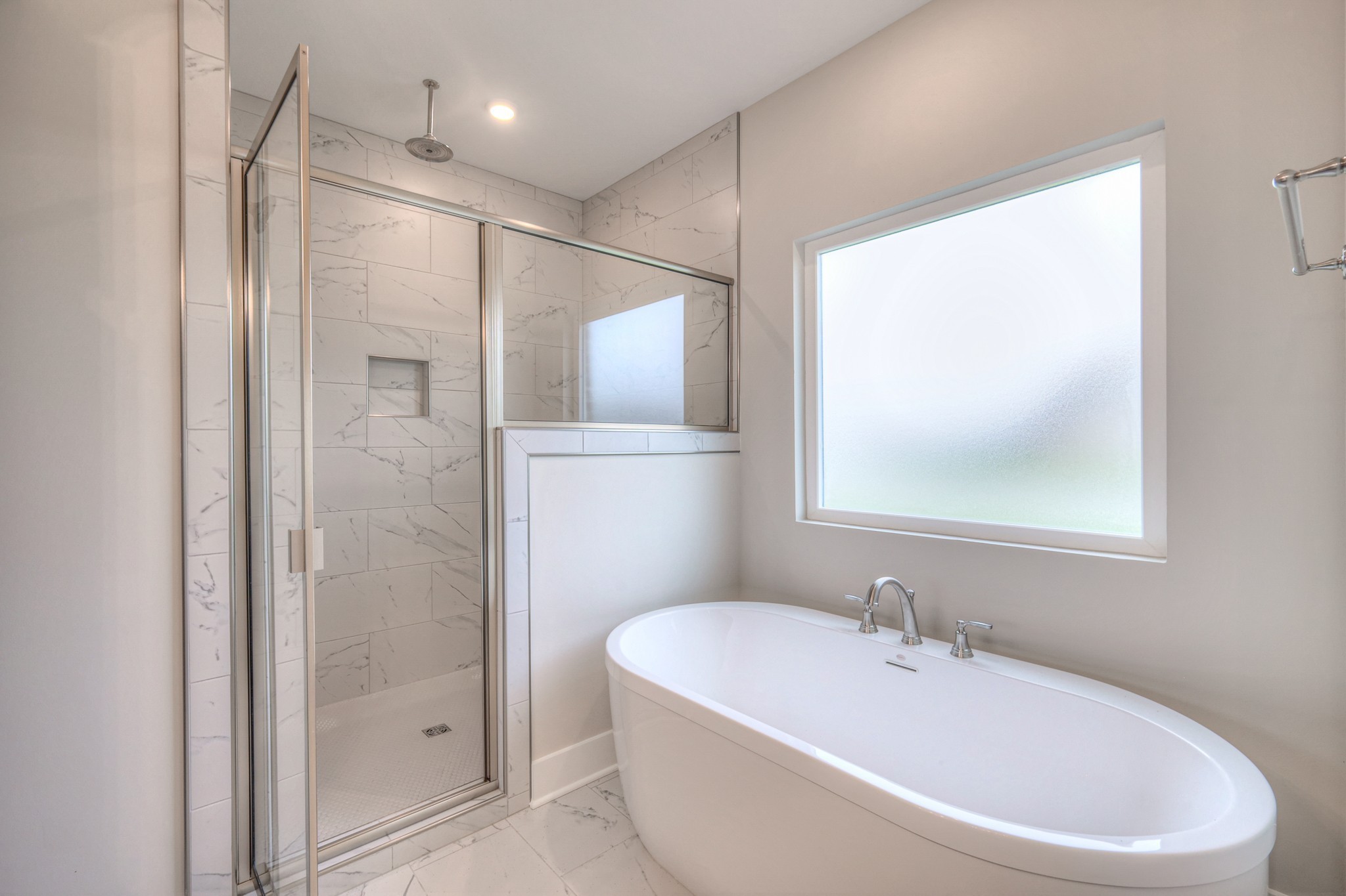 5536 Sinclair Street Murfreesboro, TN 37127 - Photo 34 of 46 a bathroom with a bathtub and a shower