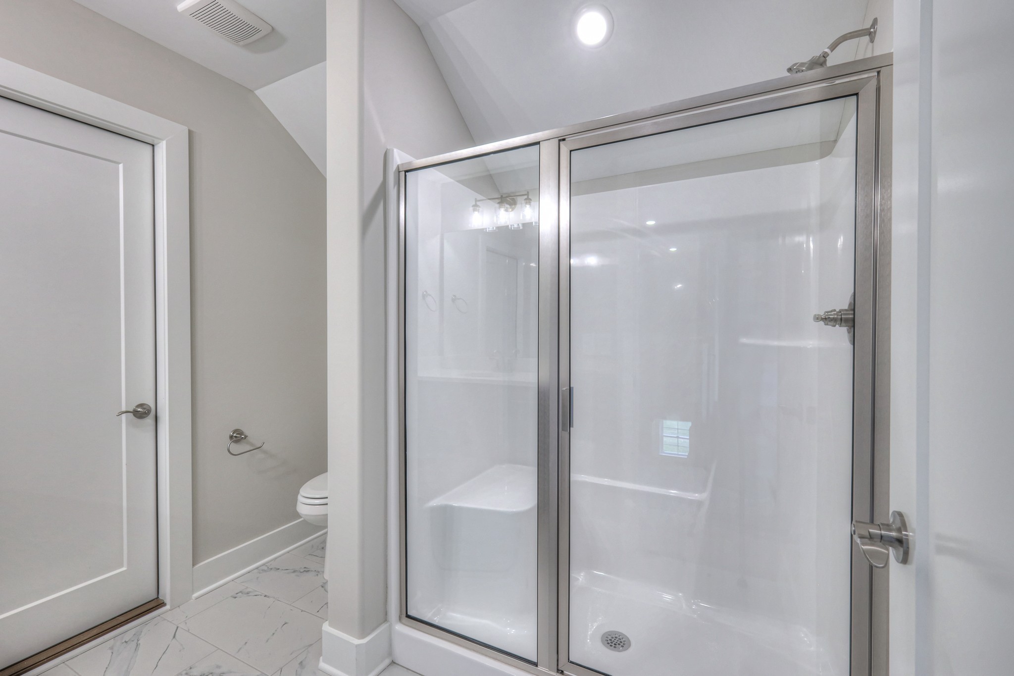5536 Sinclair Street Murfreesboro, TN 37127 - Photo 42 of 46 a bathroom with a glass shower door and a toilet