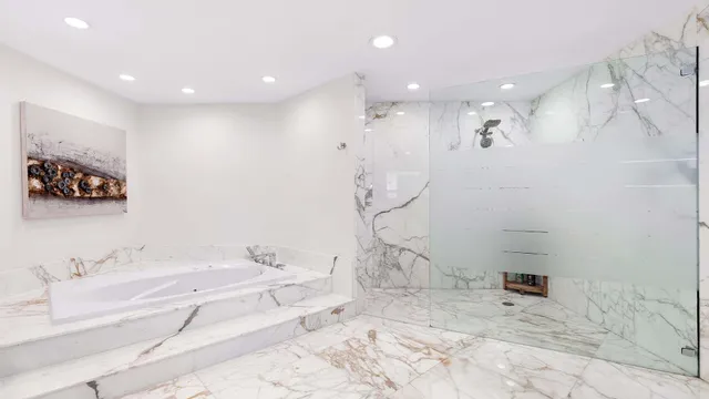 a bathroom with a bathtub and a shower