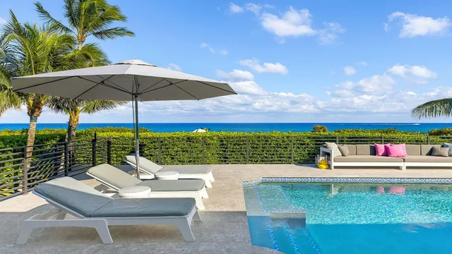 a view of a chairs and table under an umbrella