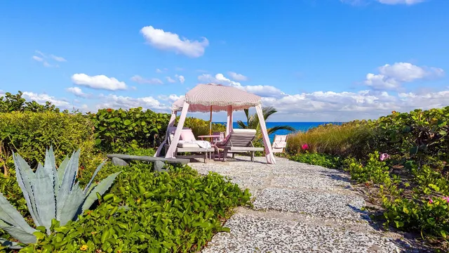 a view of a backyard with sitting area