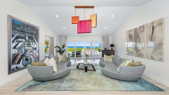 a living room with furniture and a potted plant
