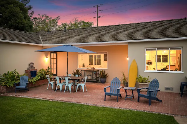 a patio with table and chairs
