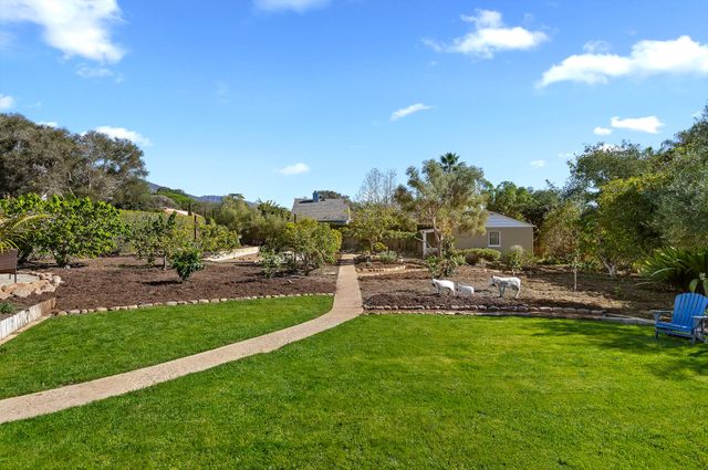 a view of a playground with a yard