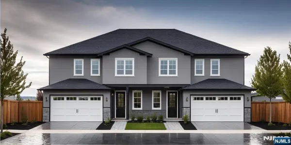 a front view of a house with a garage