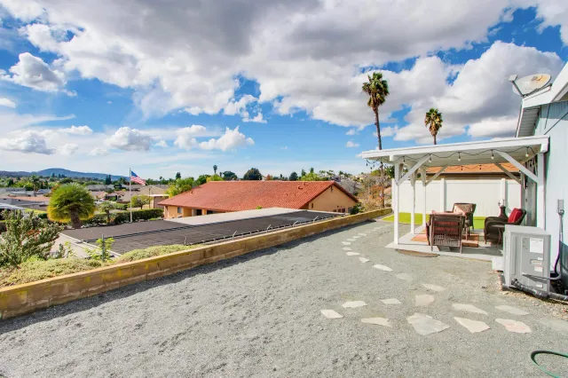 a view of a house with tub and chairs