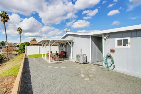 a view of a patio with a table and chairs
