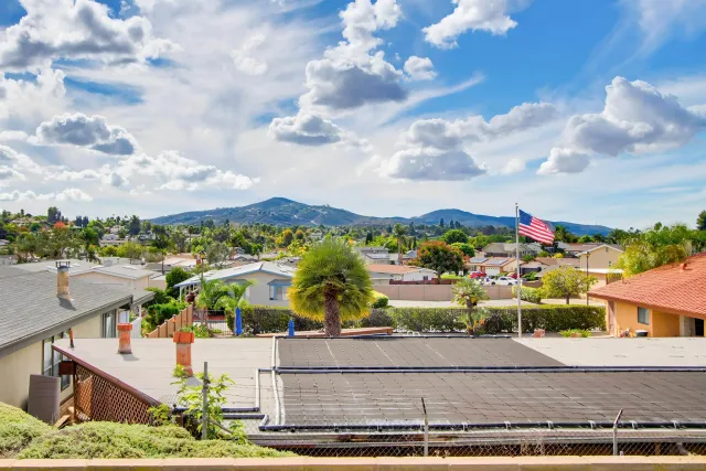 a view of a swimming pool and outdoor seating