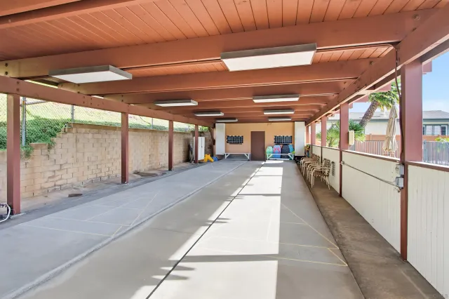 a front view of a house with lots of green space