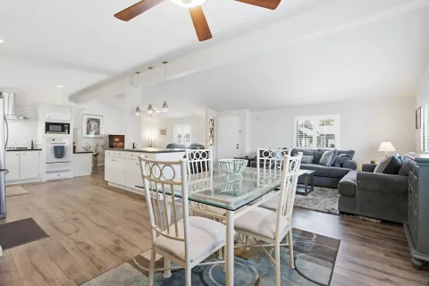 a living room with furniture and kitchen view