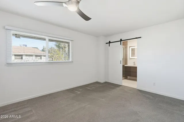 a view of an empty room with a window