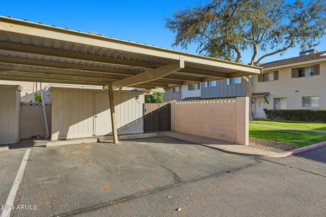 a view of backyard with a garden and trees
