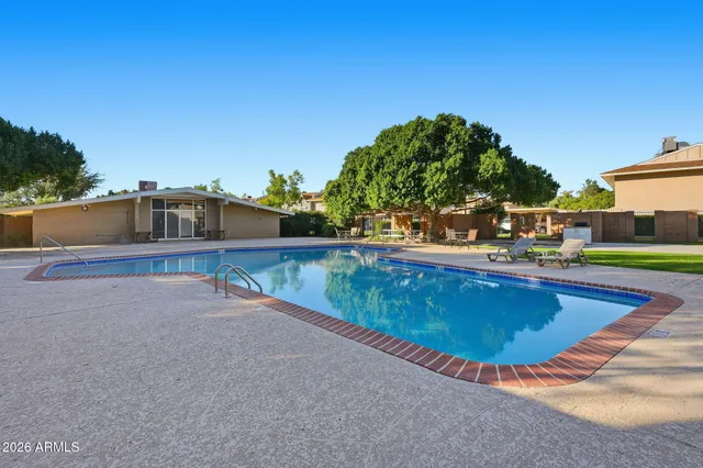 a swimming pool with outdoor view