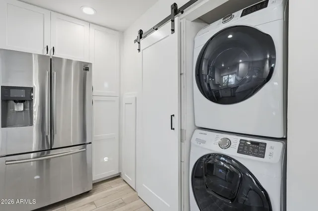 a view of a refrigerator and washer in a kitchen
