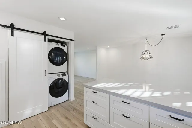 a bathroom with a washer and dryer