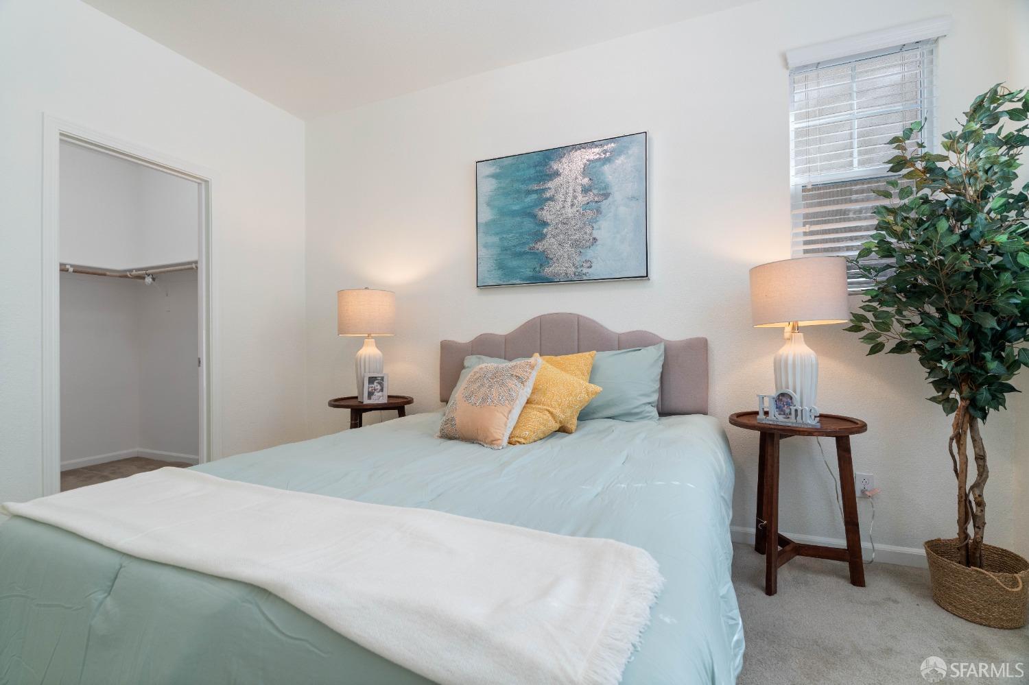 324 MacArthur Way Brentwood, CA 94513 - Photo 17 of 45 a bedroom with bed and a potted plant