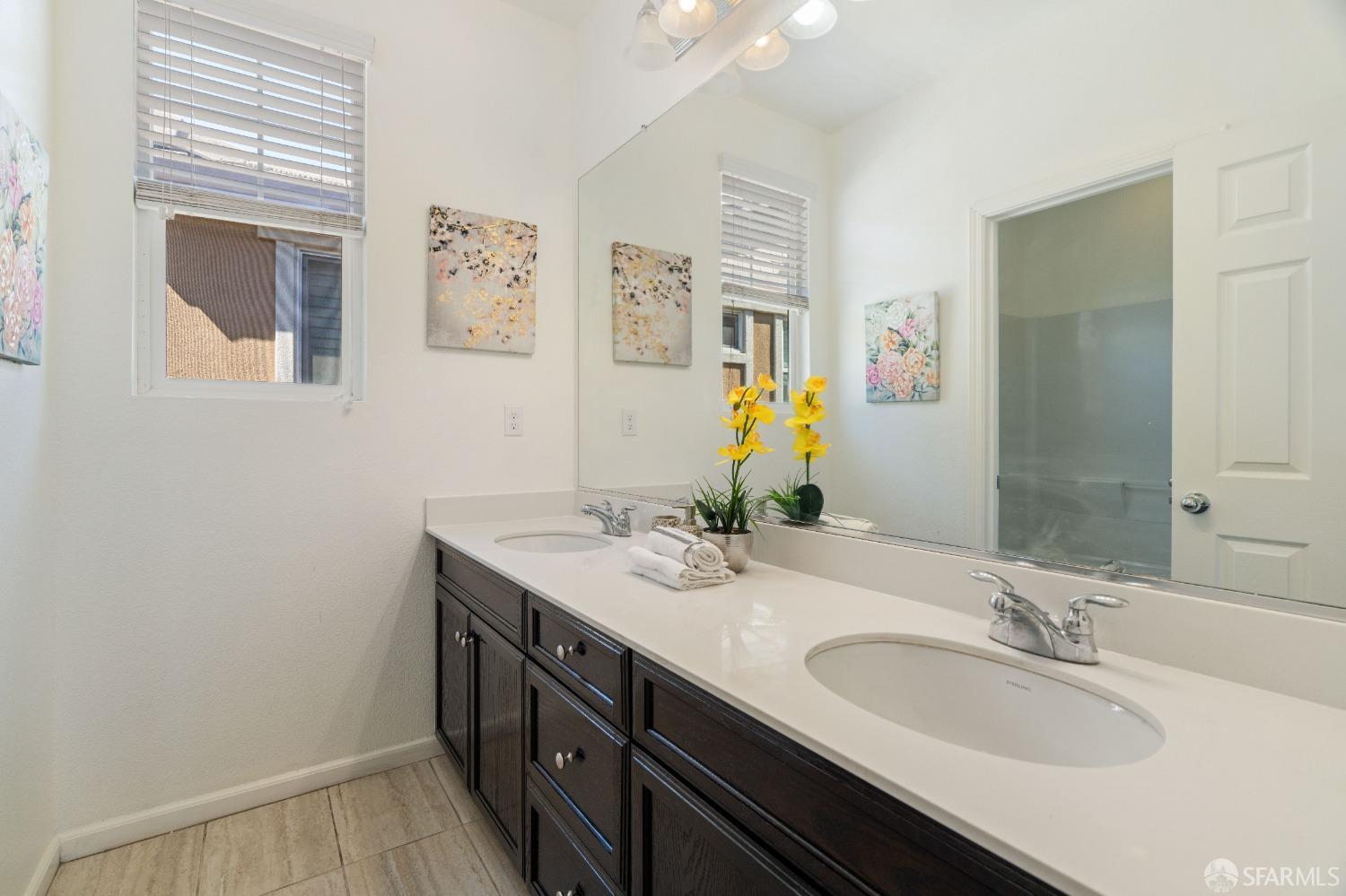 324 MacArthur Way Brentwood, CA 94513 - Photo 24 of 45 a bathroom with a granite countertop sink and a mirror