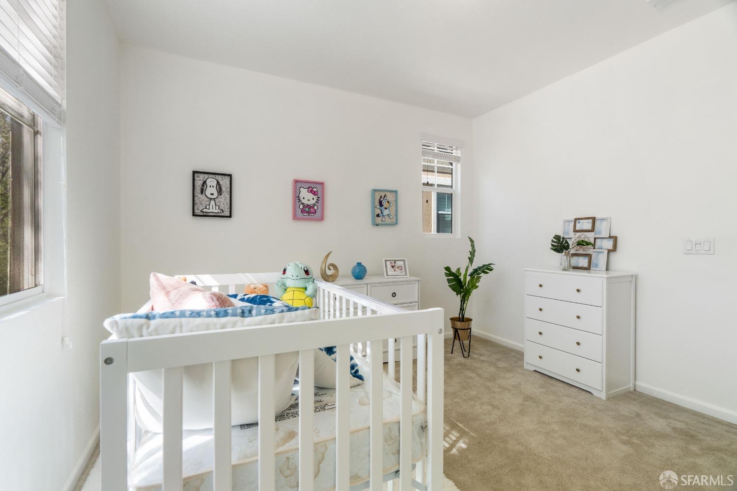 324 MacArthur Way Brentwood, CA 94513 - Photo 27 of 45 a bedroom with furniture and a wooden floor