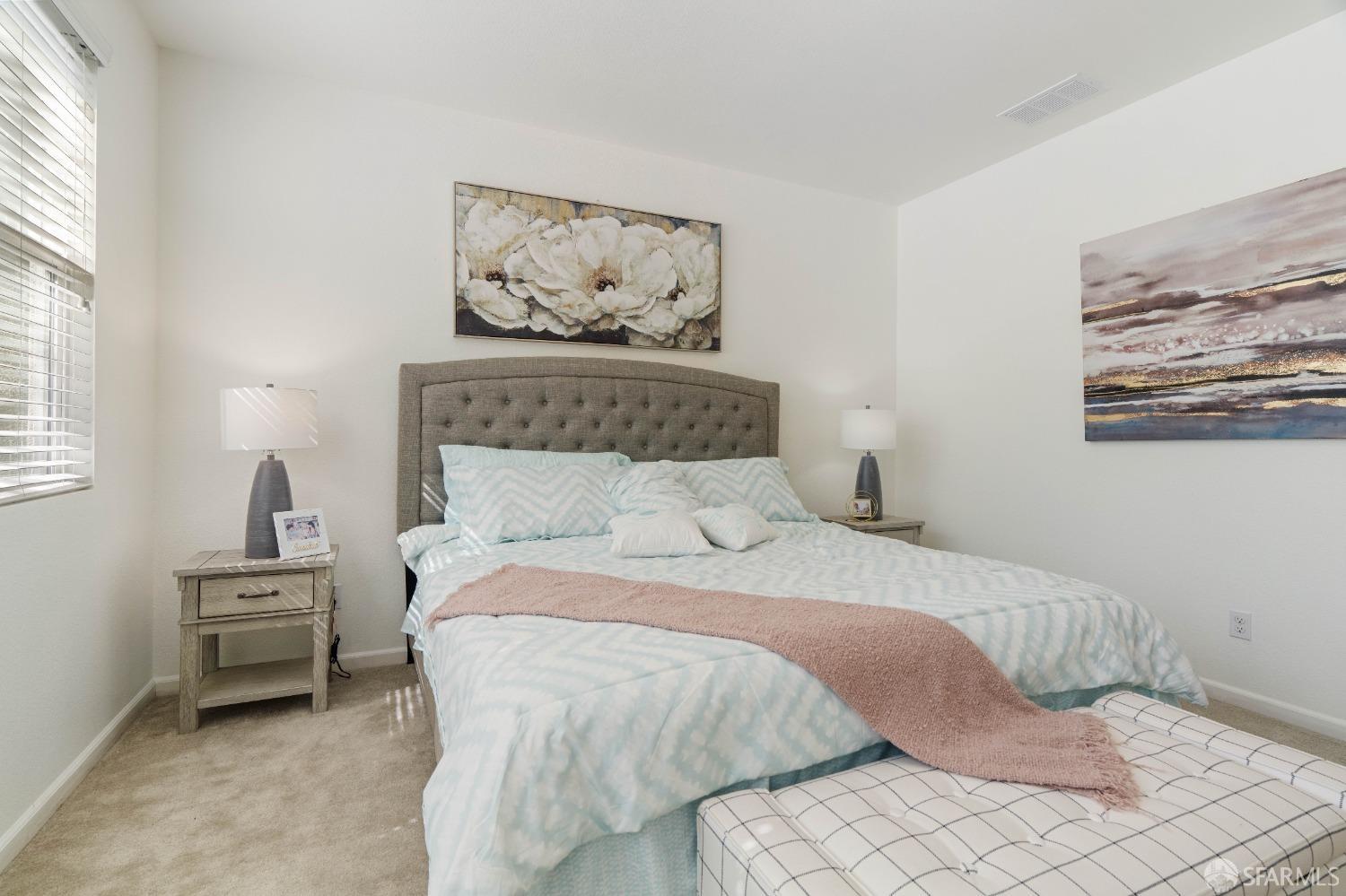 324 MacArthur Way Brentwood, CA 94513 - Photo 30 of 45 a bedroom with a bed and a painting on the wall