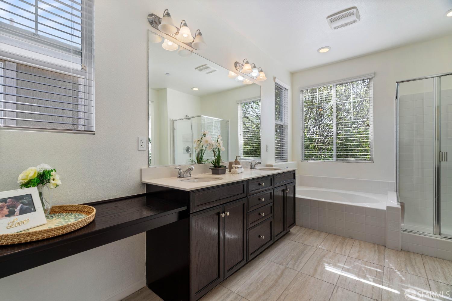 324 MacArthur Way Brentwood, CA 94513 - Photo 34 of 45 a bathroom with a granite countertop sink mirror and a bathtub
