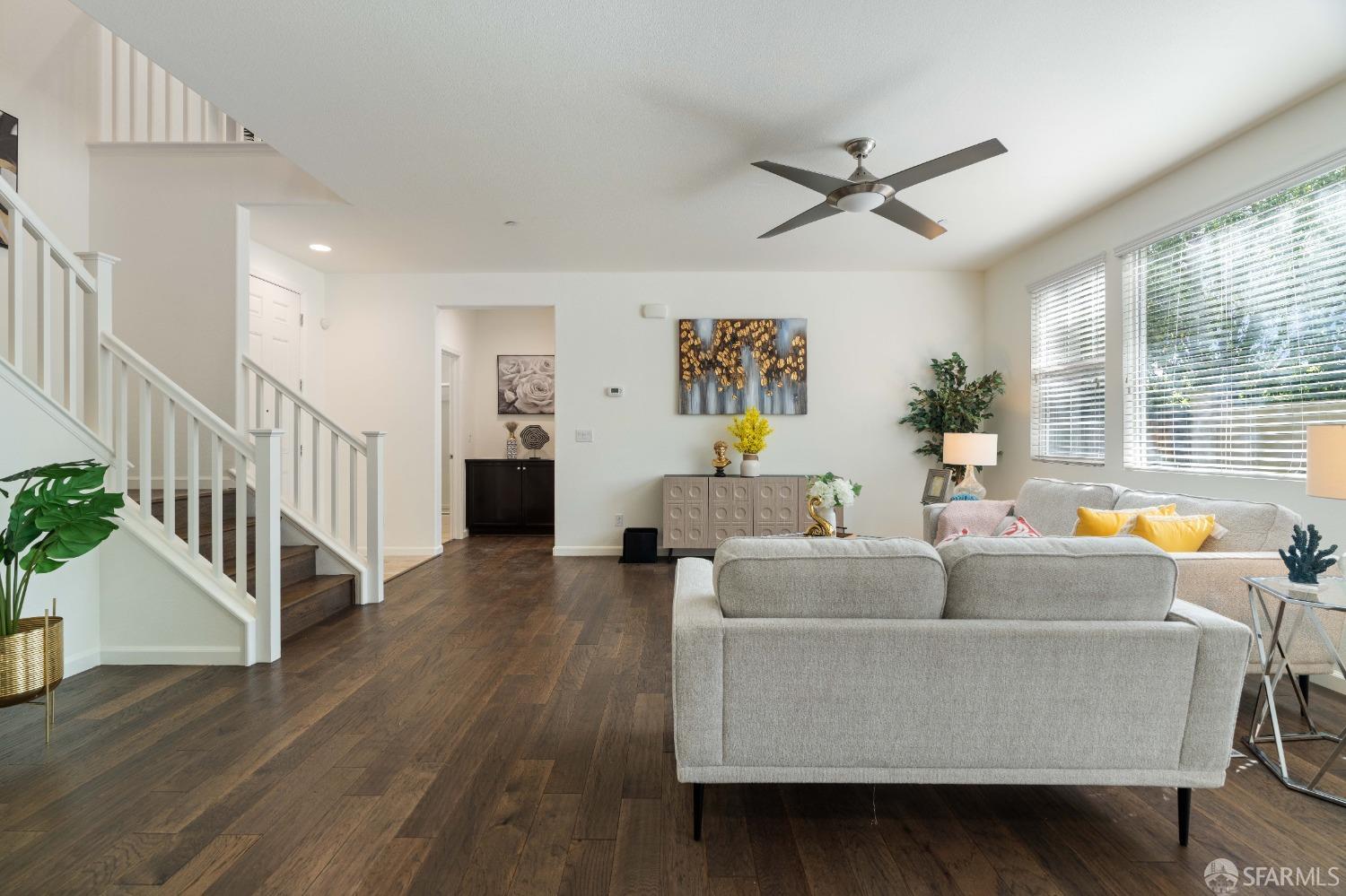 324 MacArthur Way Brentwood, CA 94513 - Photo 8 of 45 a living room with fireplace furniture wooden floor and a large window