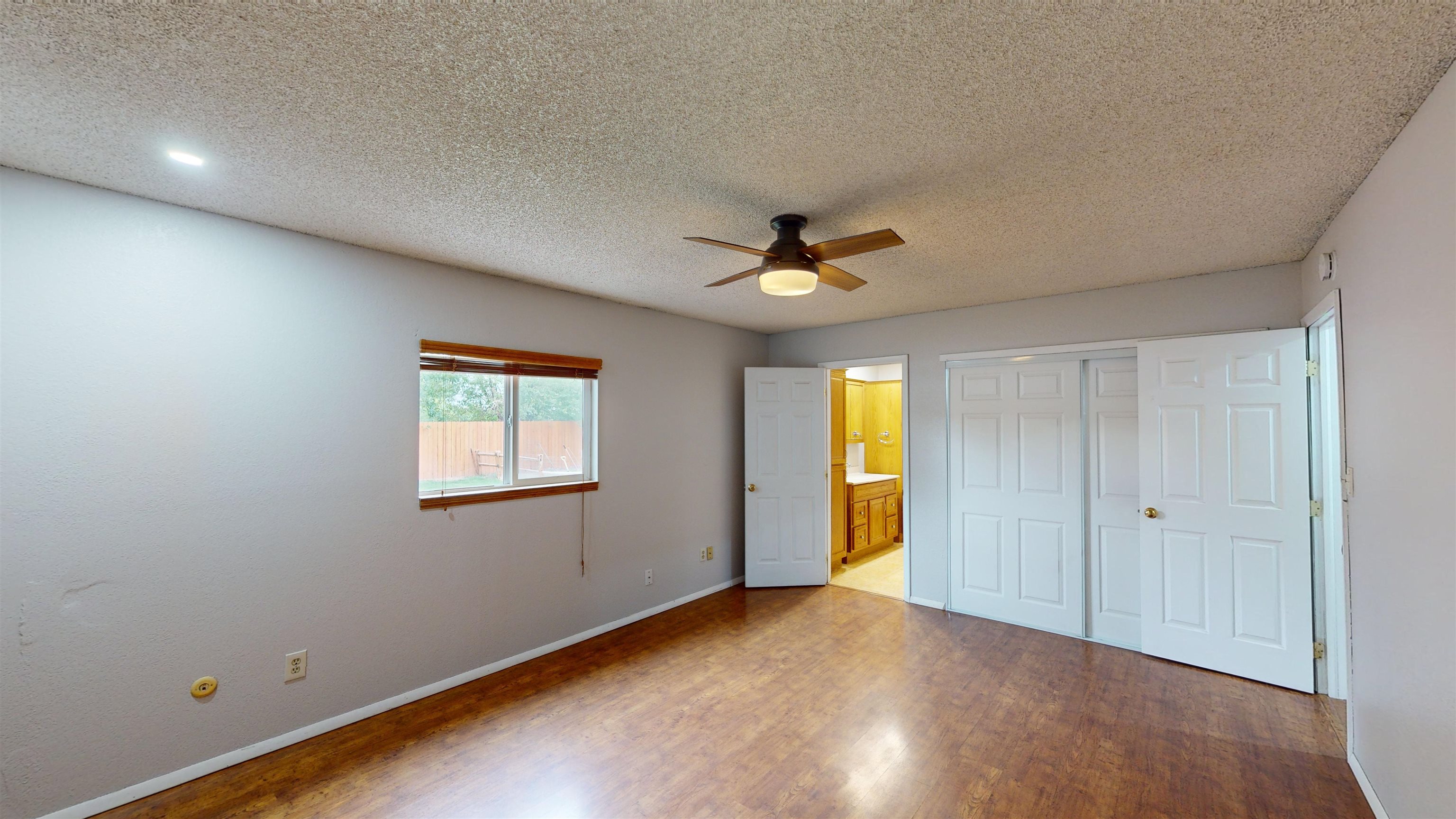 449 Doris Road Grand Junction, CO 81504 - Photo 14 of 35 a view of empty room with wooden floor and fan